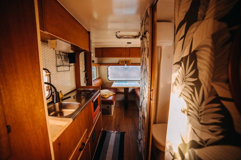 A camper kitchenette and dining nook