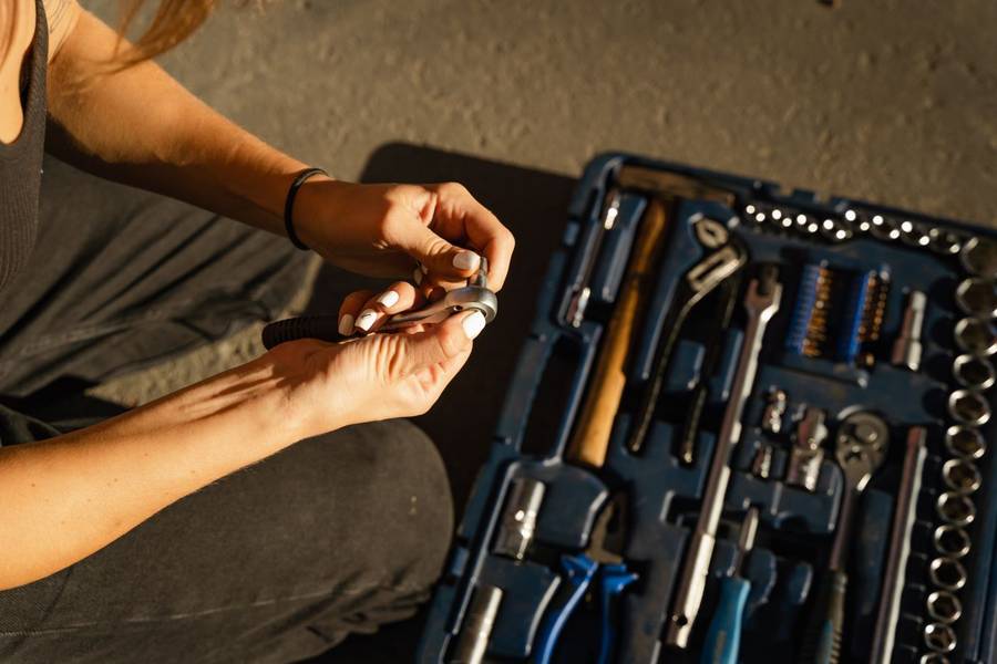 Hands at work with tools from a tool set