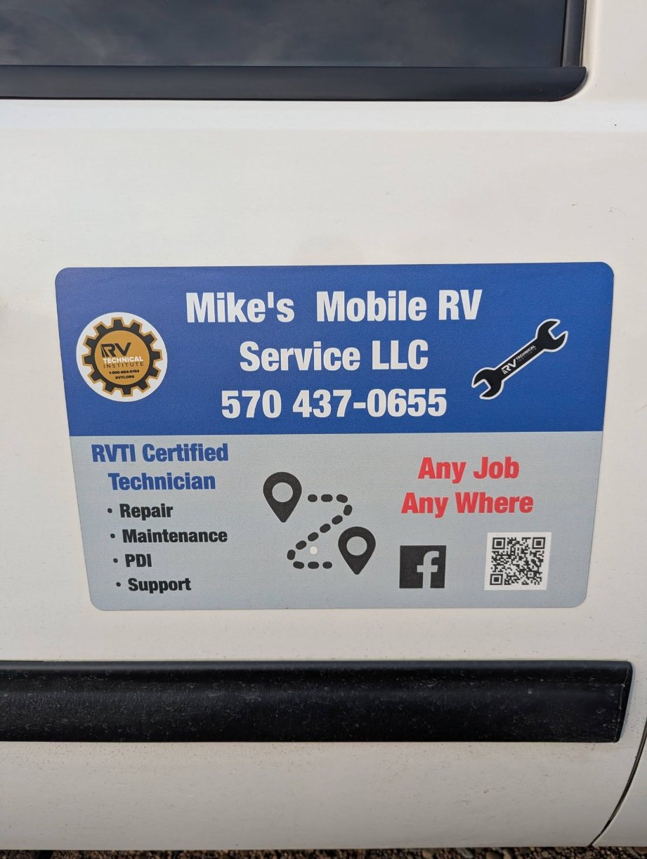 The sign on Mike's truck: RVTI Certified Technician, Repair, Maintenance, PDI, Support. Any Job, Any Where.